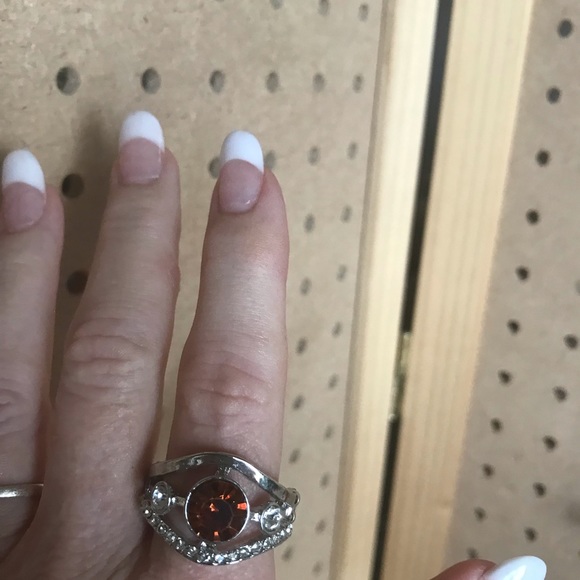Double tiered silver ring with round center stone